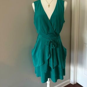 DKNY silk Teal green ruffle dress. Sleeveless v-neck. Has two pockets and belt